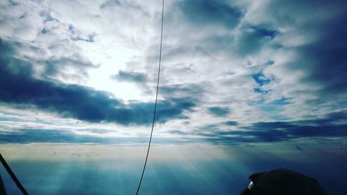 Low angle view of man looking against sky