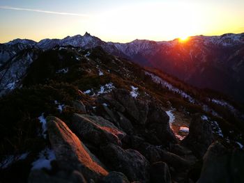 Scenic view of mountains against sky during sunset