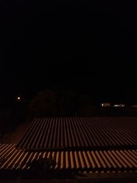 Illuminated roof against sky at night