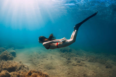 Woman swimming in sea