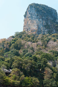 Low angle view of rock formation on mountain against clear sky