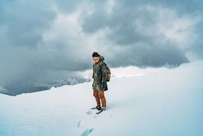 Full length of man standing on snow