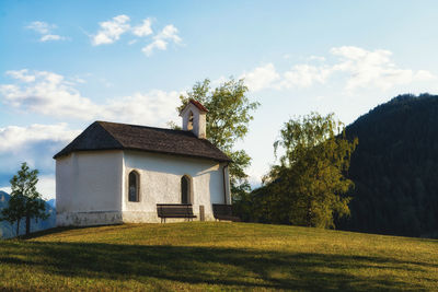 House on field against sky