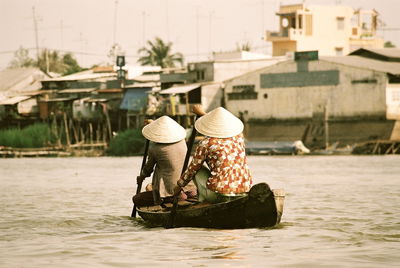 People working on boat in water