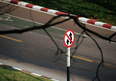 The overtaking prohibited sign on the road 