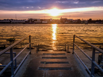 View of city against sky during sunset