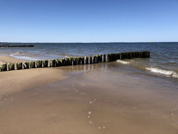 Scenic view of sea against clear sky