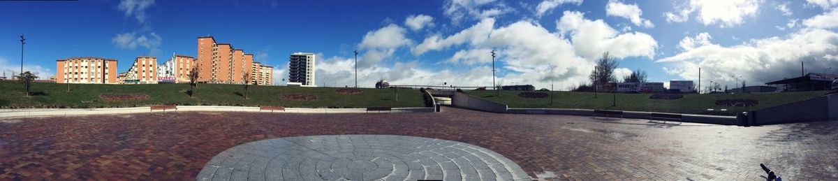 View of buildings against cloudy sky