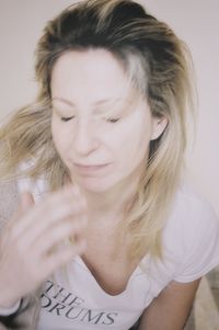 Portrait of beautiful young woman with eyes closed