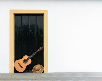 View of guitar in glass window