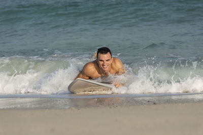 Portrait of young man in sea