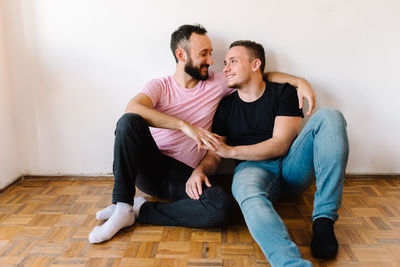 Gay couple in their apartment.