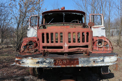 Old rusty train against trees