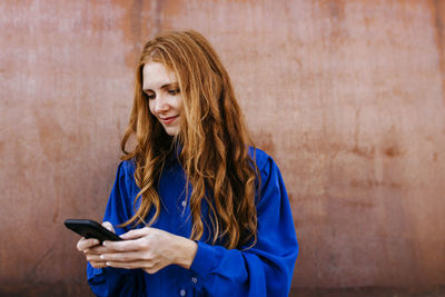 Young woman using mobile phone