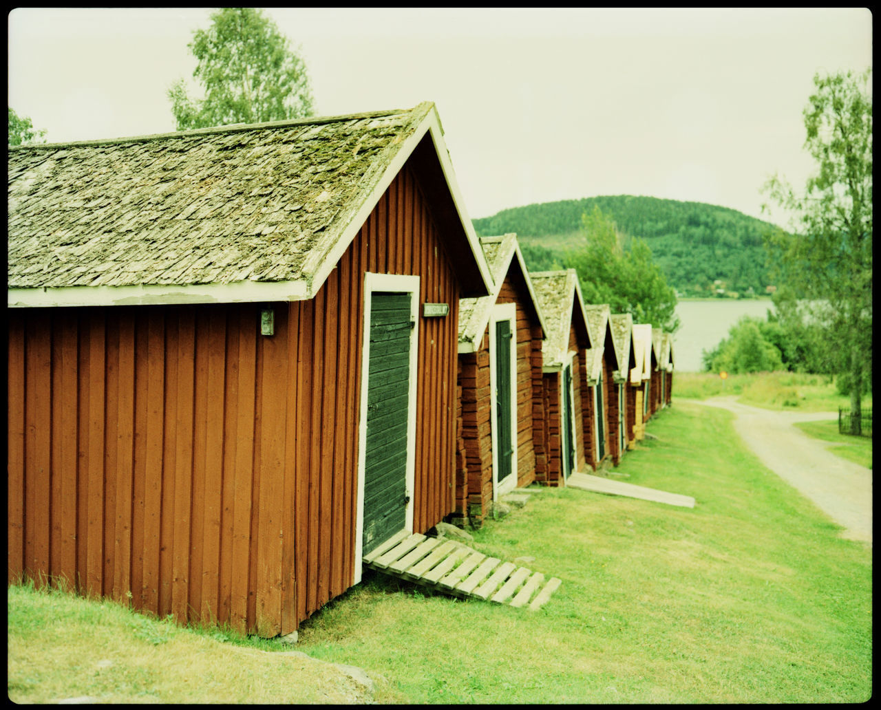 The Lake Sheds of Nordingra Analogue Photography Architecture Lake Sheds Nature Nordingrå North Sweden Plaubel Makina 67 Sweden Swedish Architecture Travel Boat Boat House Garage High Coast Hut Idyllic Lake Lake House  Lakeside Sea Side Swedish Lake Xpro