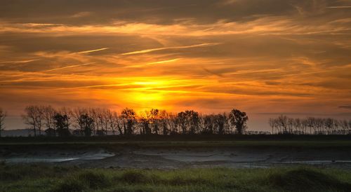 Scenic view of sunset over lake