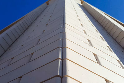 Low angle view of building against blue sky