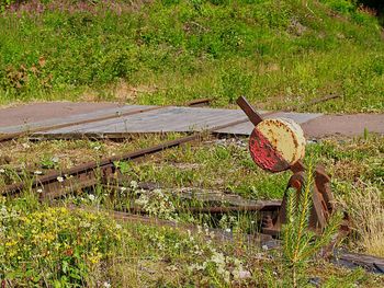 High angle view of abandoned bench on field