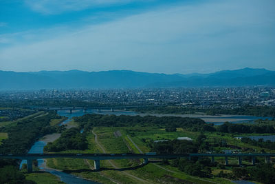 High angle view of city buildings against sky