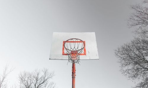 Low angle view of basketball hoop against clear sky