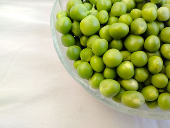 High angle view of green peas in bowl