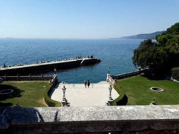 High angle view of people on sea against clear sky