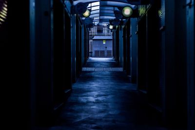 Low angle view of empty corridor of building