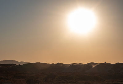 Scenic view of mountains against sky during sunset