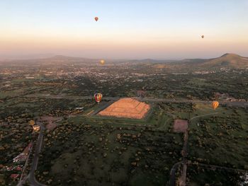 High angle view of city against sky during sunset