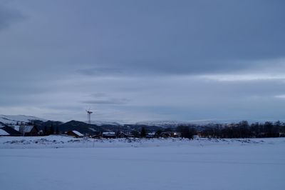 Snow covered field against sky. norway, rissa.