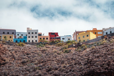 View of residential buildings against sky