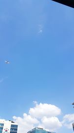 Low angle view of airplane flying in sky