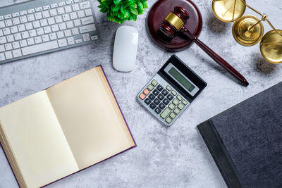 High angle view of laptop and book on table