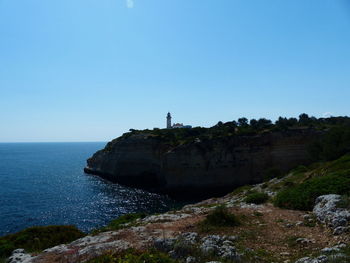 Scenic view of sea against clear blue sky