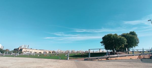 Scenic view of beach against blue sky