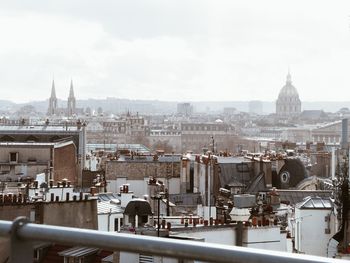 High angle view of buildings in city against sky