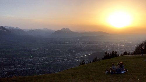 Scenic view of mountains against sky during sunset