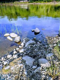 Reflection of stones in lake