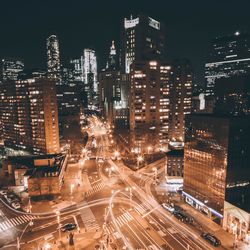 Aerial view of city lit up at night