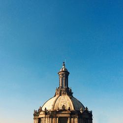 Low angle view of built structure against clear blue sky