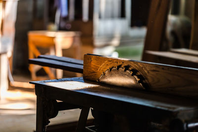 Close-up of chair on table in restaurant