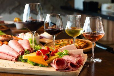 Close-up of various food with drinks served on table