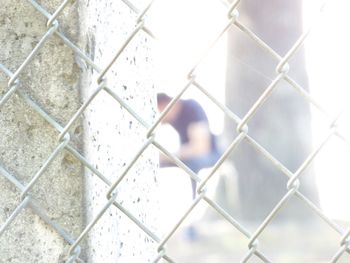 Fence seen through chainlink fence