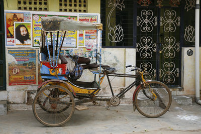 Bicycles on street against building