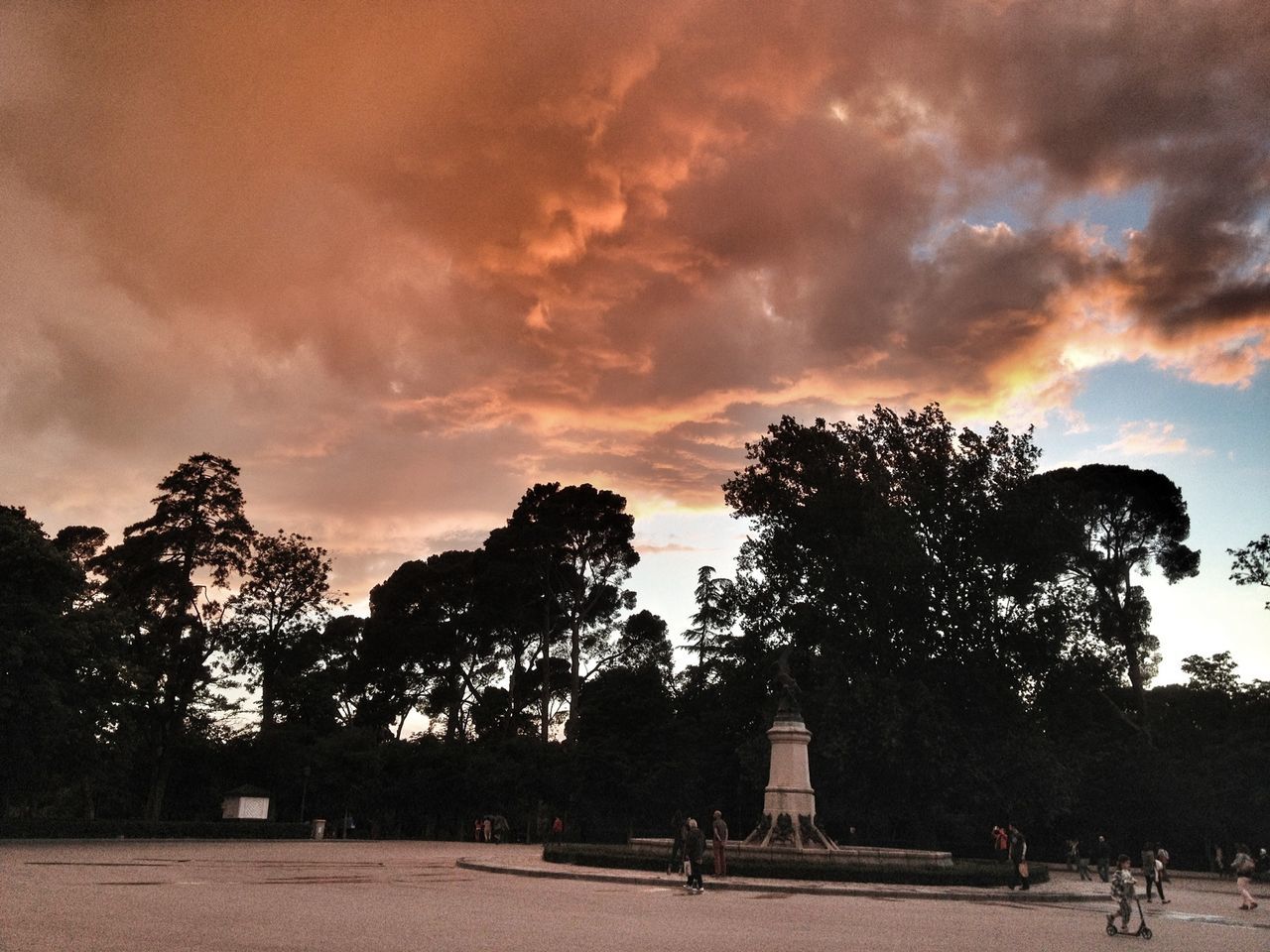 sky, tree, cloud - sky, silhouette, cloudy, cloud, built structure, sunset, architecture, building exterior, nature, tranquility, beauty in nature, outdoors, men, person, tranquil scene, overcast, scenics