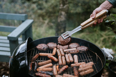 Cropped hand of man preparing food