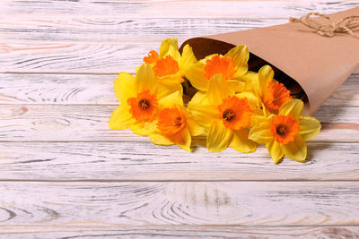 Close-up of yellow flower on table