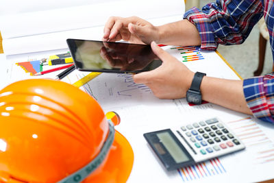 High angle view of man working on table