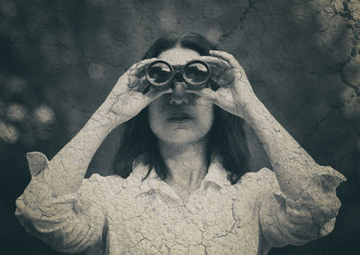 Close-up of woman photographing against sky