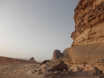 Rock formations in desert against clear sky